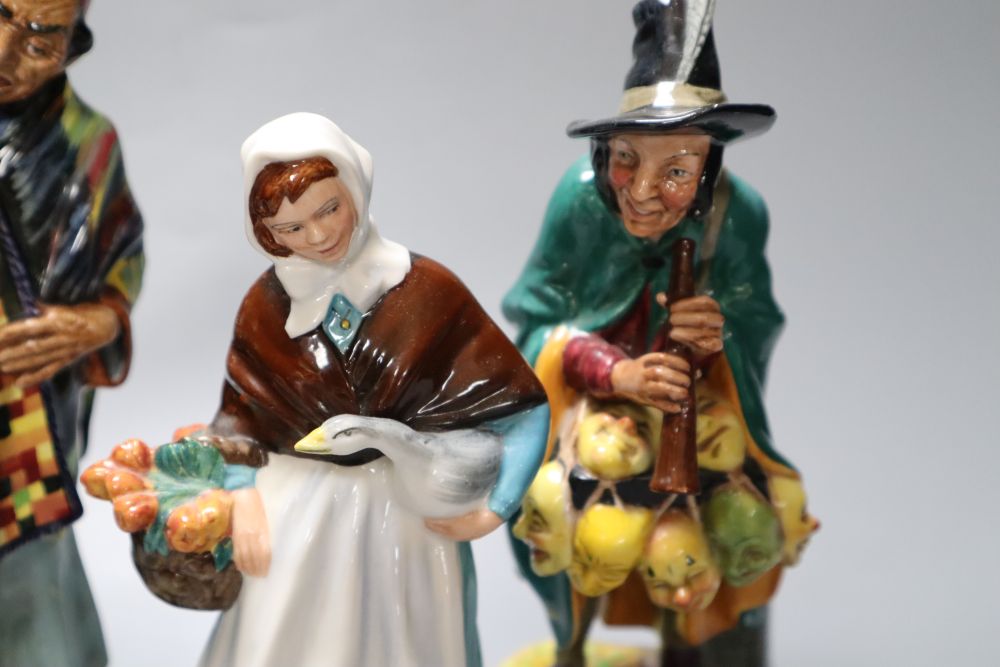 Four Royal Doulton figures, Carpet Seller, Mask Seller, Country Lass, Mary had a Little Lamb